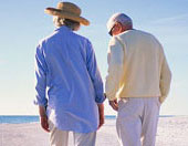 older man and woman walking